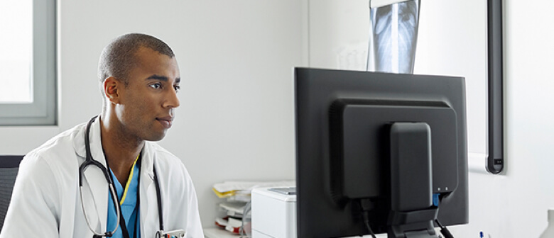 Healthcare professional intently watching something